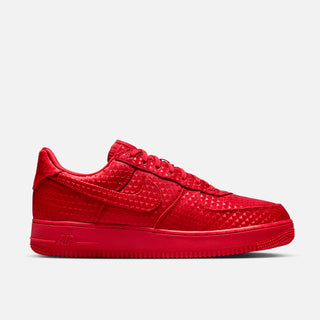 Red sneaker with Nike logo on a light gray background